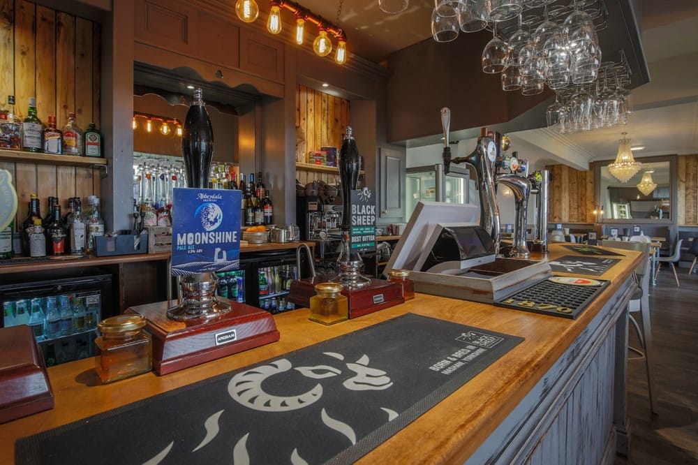 The bar at Grazing Harts with cask ales on tap